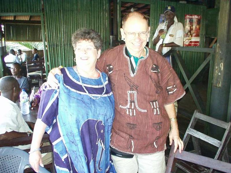Ann and Norm wearing gifts just received from Cape Coast Lodge